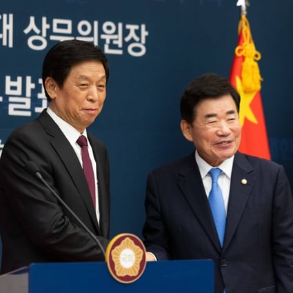 Li Zhanshu, chairman of the Standing Committee of the National Peoples Congress of China, left, shakes hands with South Korea National Assembly Speaker Kim Jin-pyo. Photo: Bloomberg