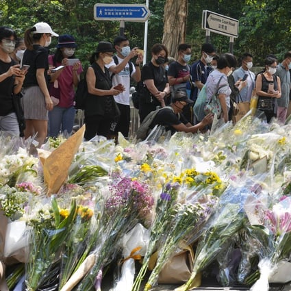 Queues of mourners wait to lay flowers or pay their respects outside the British Consulate-General in Admiralty earlier this week. Photo: Sam Tsang.