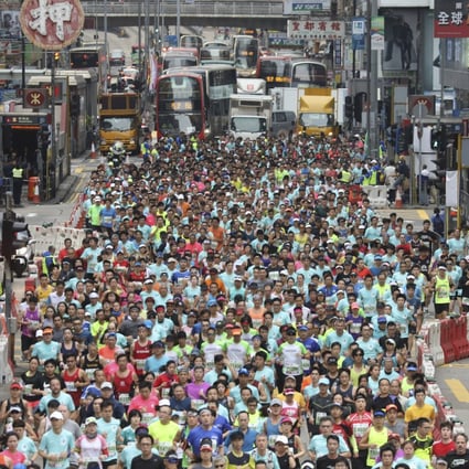 Runners hit the streets on Nathan Road during the 2019 Standard Charted Hong Kong Marathon. Photo: Dickson Lee.