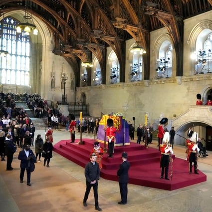 Members of the public file past the coffin of Queen Elizabeth lying in state in Westminster Hall  ahead of her funeral on Monday. Photo: Reuters