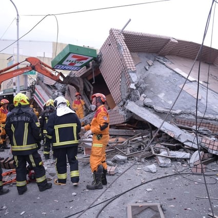 Emergency workers attend the scene of a collapsed building in Yuli township, Hualien county, after an earthquake on Sunday. Photo: AP