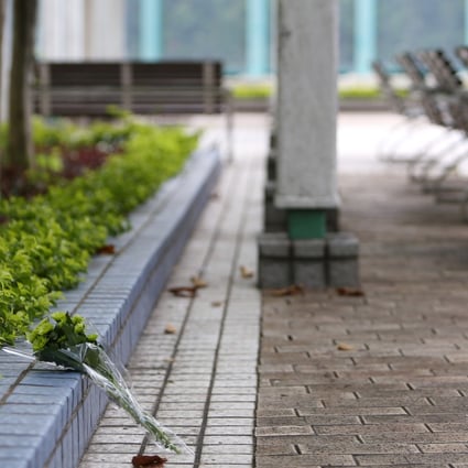 Flowers were left for the victims of a shooting at Quarry Bay Park in 2018. The murderer has been charged for attempting to bribe a prison official. Photo: Xiaomei Chen