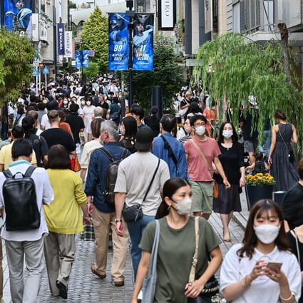 Shoppers walk along a street lined with shops in Yokohama, south of Tokyo. Japan’s inflation has quickened to its fastest rate in more than 30 years. Photo: AFP