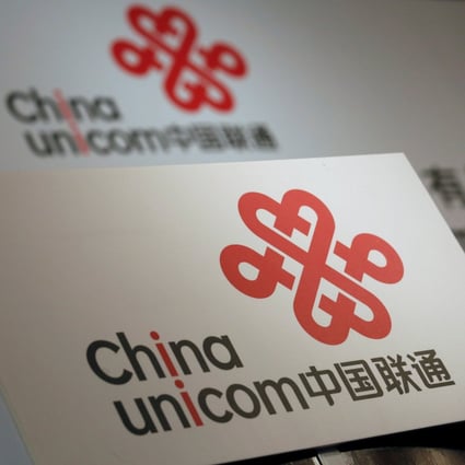 China Unicom logos are displayed at a news conference in Hong Kong in March 2016. Phooto: Reuters