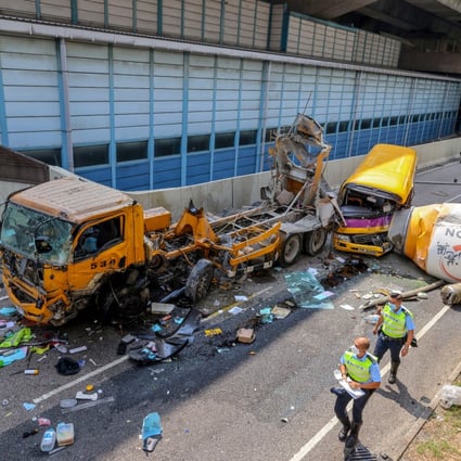 A cement mixer fell off a flyover and hit a school bus in Cheung Sha Wan. The truck driver died and four others were injured in the incident. Photo: Dickson Lee