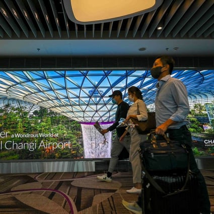Passengers arrive at the reopened Changi International Airport Terminal 4 in Singapore on September 13, following a closure for more than two years due to the Covid-19 coronavirus pandemic. Photo: AFP