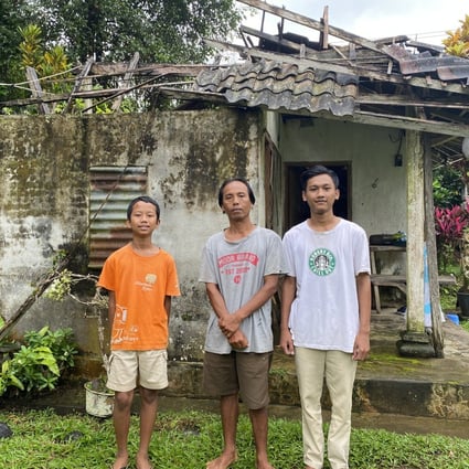 I Made Nuka (centre) struggles to send his youngest child to middle school as prices of basic goods and fuel are rising, limiting his job opportunities as a construction worker. Photo: SCMP / Resty Woro Yuniar 