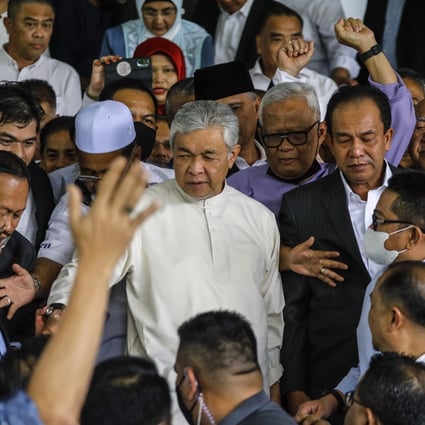 Zahid (centre) is part of a wider group of Umno politicians facing criminal cases that is often referred to as the “Kluster Mahkamah”, the court cluster, by local media. Photo: EPA-EFE