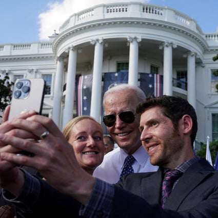US President Joe Biden posing for a selfie with guests at the White House on September 13. Photo: Reuters
