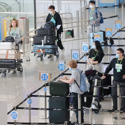 Passengers line up at a quarantine processing area  in the arrivals hall at Hong Kong International Airport on Wednesday.  Photo: Jelly Tse