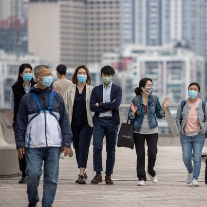 People wear face masks while outdoors in Hong Kong on March 29. The anti-Covid-19 measures have touched so many areas of our lives. Photo: EPA-EFE