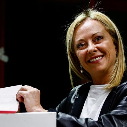 Leader of Brothers of Italy Giorgia Meloni poses with her ballot at a polling station in Rome. Photo: Reuters