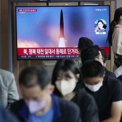 Passengers pass through Seoul Railway Station in Seoul, South Korea, on Sunday, amid reports of North Korea fired a short-range ballistic missile. Photo: AP
