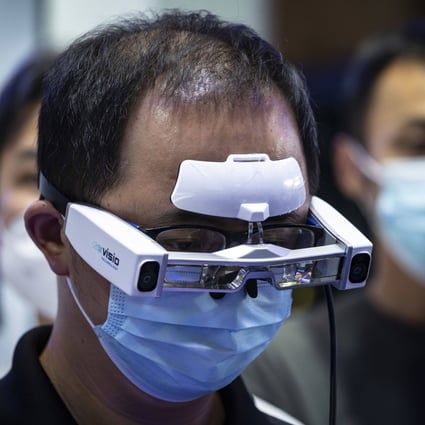 A visitor tries an augmented reality glasses at the World Artificial Intelligence Conference in Shanghai in September 2022. Photo: Bloomberg