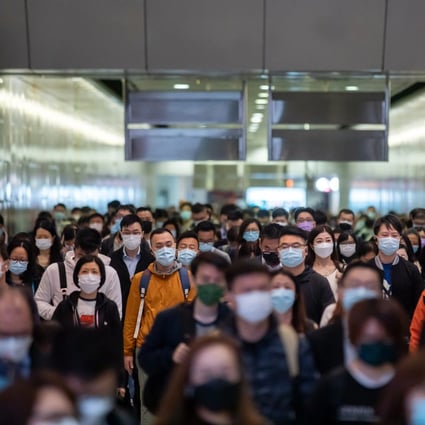 Commuters in Hong Kong’s Central district on January 27, 2022. Photo: Bloomberg