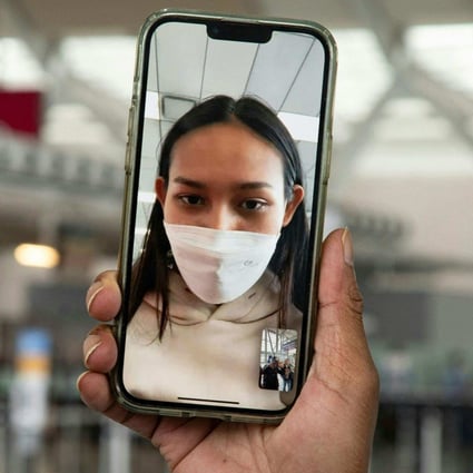 Myanmar beauty queen Han Lay speaks by video call during her arrival at Toronto Pearson International Aiport on Wednesday while she waits for a connecting flight. Photo: AFP