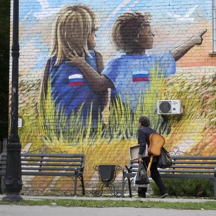 Graffiti in Luhansk, eastern Ukraine. Children are stranded in camps in the region. Photo: AP