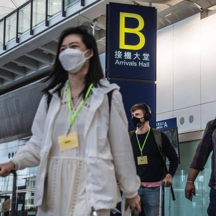 Travelers walk through the arrival hall at Hong Kong International Airport following the local government’s scrapping of its hotel quarantine regime on September 26, 2022.  Photo: Bloomberg
