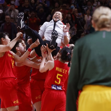 China coach Wei Zheng is raised aloft by her team after their World Cup semi-final win over Australia. Photo: EPA-EFE
