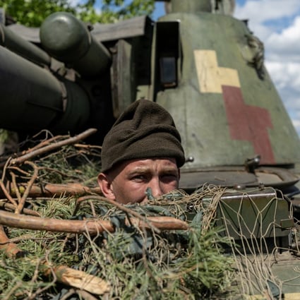 An Ukrainian soldier looks out from an armoured vehicle at Lyman, in the Donetsk region, in April. Photo: Reuters