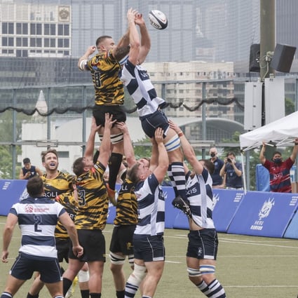 Football Club (white and blue stripes) and USRC Tigers contest a line-out at King’s Park on Saturday. Photo: Jonathan Wong