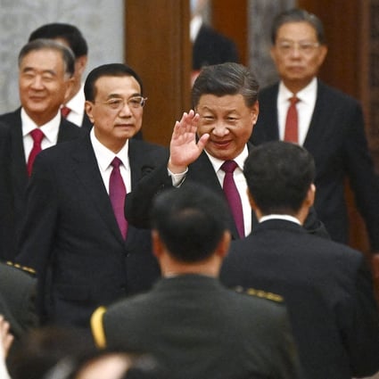 President Xi Jinping (centre) and Premier Li Keqiang (on Xi’s left) arrive for a reception at the Great Hall of the People on the eve of China’s National Day in Beijing. Photo: AFP