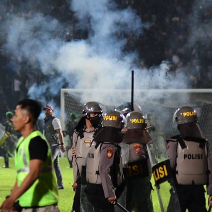 At least 125 people were killed in one of the deadliest disasters in the history of football, when officers fired tear gas in a packed stadium, triggering a stampede in Indonesia. Photo: AFP/File