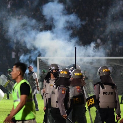 Tear gas let off by police is seen after a football match in East Java on October 1, 2022. Photo: AFP 