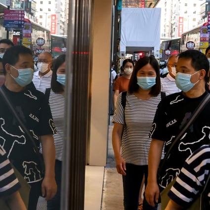 People wearing masks walk along at Nathan Road in Mong Kok on October 3. Photo: K.Y. Cheng