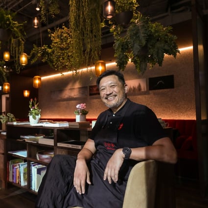 Danny Yip, founder of The Chairman, at his restaurant’s new location in Hong Kong’s Central neighbourhood. The new space has been made to feel like home through the addition of plants, art and cookbooks. Photo: Xiaomei Chen