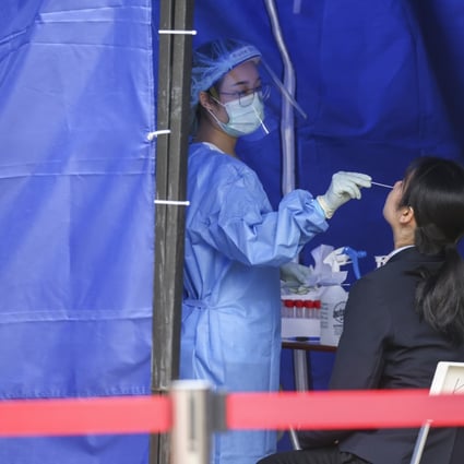 A woman gets a PCR test at a mobile centre set up at Victoria Park in Causeway Bay. Photo:  Dickson Lee.