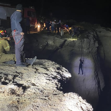 Authorities and local residents save a migrant during a large-scale rescue operation on the island of Kythira. Photo: AP