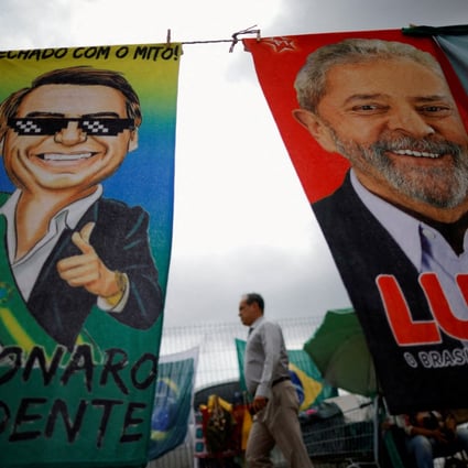 A man walks past presidential campaign posters in Brasilia, Brazil, on September 23. Photo: Reuters