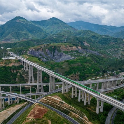 A bullet train runs through a bridge on the China-Laos Railway in southwest China’s Yunnan Province. Photo: Xinhua