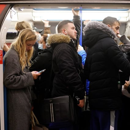Commuters crowd onto a tube train in London in February.  British officials last week warned that renewed circulation of flu and a resurgence in Covid-19 could pile pressure on the National Health Service. File photo: AFP