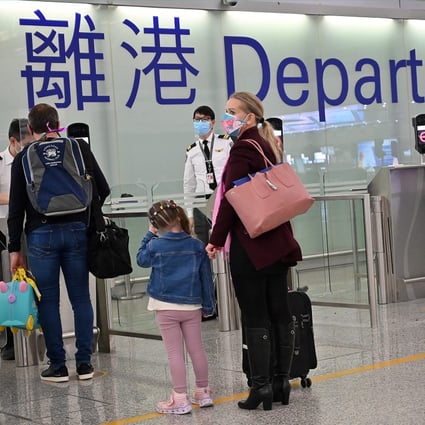Expat familes depart Hong Kong’s Chek Lap Kok international airport. Photo: AFP