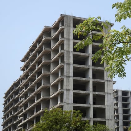 Unfinished blocks of flats stand at a residential complex in Guilin, Guangxi Zhuang autonomous region, on September 17. The struggles of China’s property market are reminiscent of the woes that plagued its US counterpart before the 2007-08 global financial crisis. Photo: Reuters