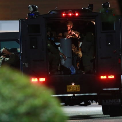 Heavily armed police officers respond to the shooting  in Raleigh, North Carolina. Photo: EPA-EFE