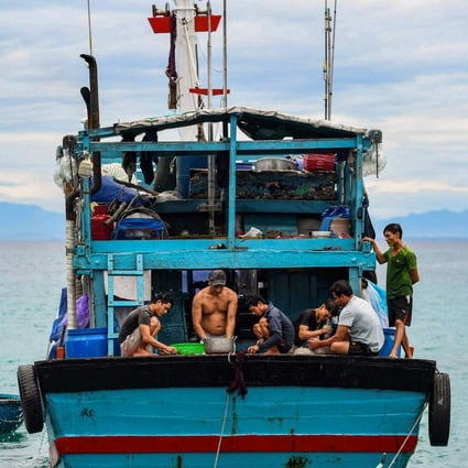 Fishermen work onboard their boat near Ly Son island in Vietnam. File photo: AFP