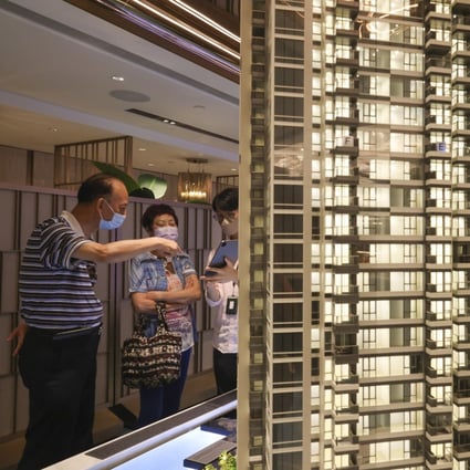 Potential buyers look at a model of Miami Quay, a residential project at Kai Tak, Hong Kong. Photo: Dickson Lee
