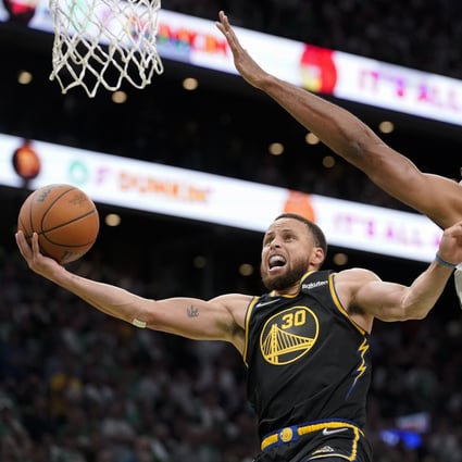 Golden State Warriors guard Stephen Curry goes up for a shot against Boston Celtics centre Al Horford. Photo: AP