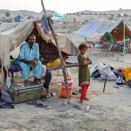 A displaced family takes refuge in a camp after monsoon rains and floods in Sehwan, Pakistan, on September 15. Photo: Reuters