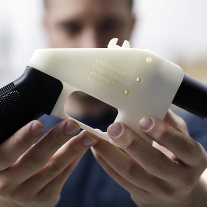 Cody Wilson holds a 3D-printed gun called the Liberator. File photo: AP