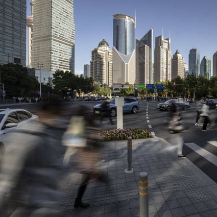 Pedestrians in the Lujiazui Financial District in Shanghai on October 10, 2022. Photo: Bloomberg