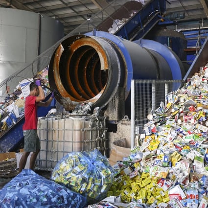 A worker operates machinery at Mil Mill, Hong Kong’s only recycling plant dedicated to beverage cartons, on September 15 in Yuen Long. Photo: K. Y. Cheng