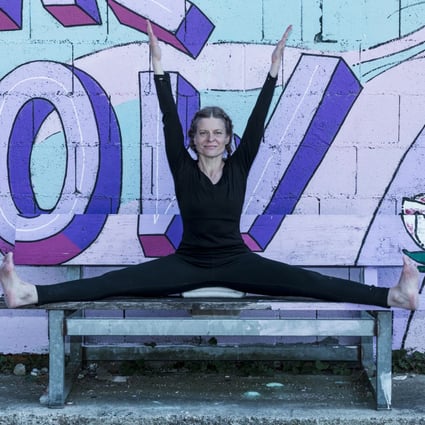 Petra Winkler-Hirter in upavishtha konasana pose, in Germany, in 2022. Iyengar yoga helped the former massage therapist through chemotherapy’s side effects and recover from breast cancer. Photo: Courtesy of Petra Winkler-Hirter