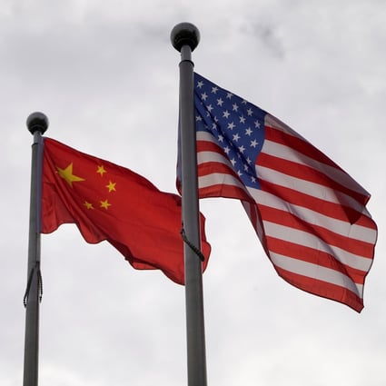 Chinese and US flags flutter outside a building in Shanghai in November 2021. Photo: Reuters
