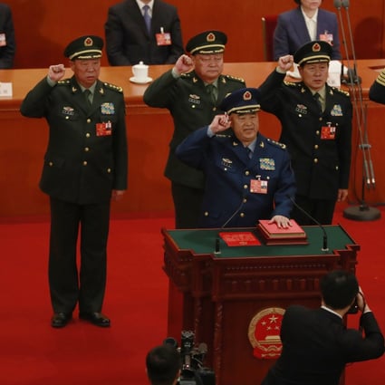 Then newly elected vice chairmen of the Central Military Commission, Xu Qiliang (foreground) and Zhang Youxia (third left) with CMC members (from left) Zhang Shengmin, Li Zuocheng, Wei Fenghe and Miao Hua swear an oath on the constitution at the Great Hall of the People in Beijing in March 2018. Photo: EPA-EFE 