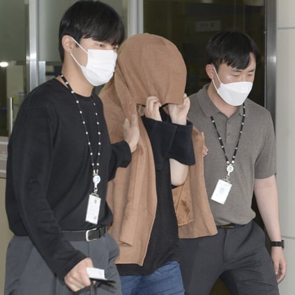 A woman was arrested in South Korea in September on two murder charges from New Zealand, where the bodies of two long-dead children were found last month in abandoned suitcases, authorities said. Photo: AP/File