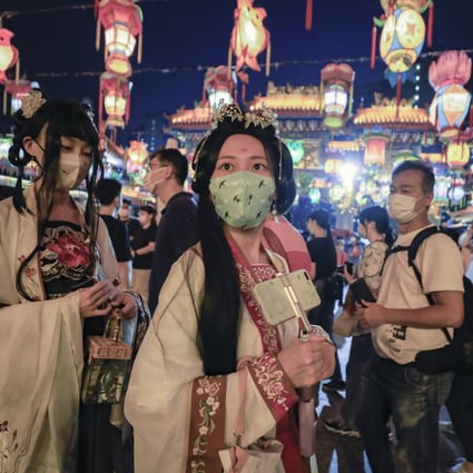 People wear traditional dress and hold colourful lanterns in celebration of the Mid-Autumn Festival at Sik Sik Yuen’s Lantern Carnival in Wong Tai Sin, Hong Kong, on September 10. Photo: Xiaomei Chen